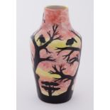 Moorcroft stoneware vase decorated with bird in trees, stamped Cobridge, 16.5cm.
