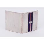 A Goldsmiths & Silversmiths cigarette case of Art Deco style with an enamel & crest decoration, in