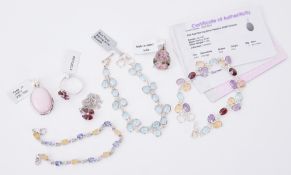 A mixed lot of silver jewellery to include a blue topaz bracelet, multi-gemstone bracelet,