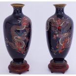 A pair of Japanese Meiji cloisonne vases with dragon decoration on carved wood stands, overall