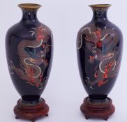 A pair of Japanese Meiji cloisonne vases with dragon decoration on carved wood stands, overall