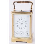 A 20th century French brass carriage clock, the enamelled dial set with Roman and Arabic numerals,