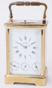 A 20th century French brass carriage clock, the enamelled dial set with Roman and Arabic numerals,