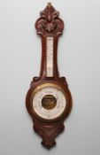 An Edwardian mahogany cased wall barometer and thermometer, maker Robson & Co, 46 Dean St.