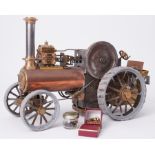 A traction steam engine designed by Henry Greenly, with label 1991, 11" tall and 16" long.