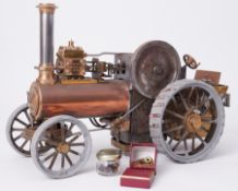 A traction steam engine designed by Henry Greenly, with label 1991, 11" tall and 16" long.