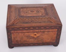 A Victorian walnut and parquetry inlaid sewing box the lid with a pictorial scene with a fitted tray