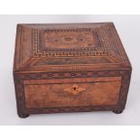 A Victorian walnut and parquetry inlaid sewing box the lid with a pictorial scene with a fitted tray