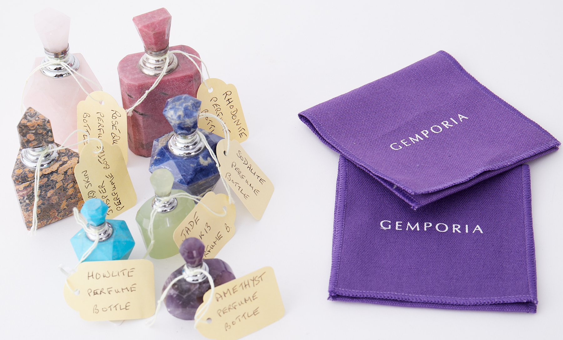 A collection of ten gemstone scent bottles including jade, rose quartz, amethyst, howlite, sodalite,