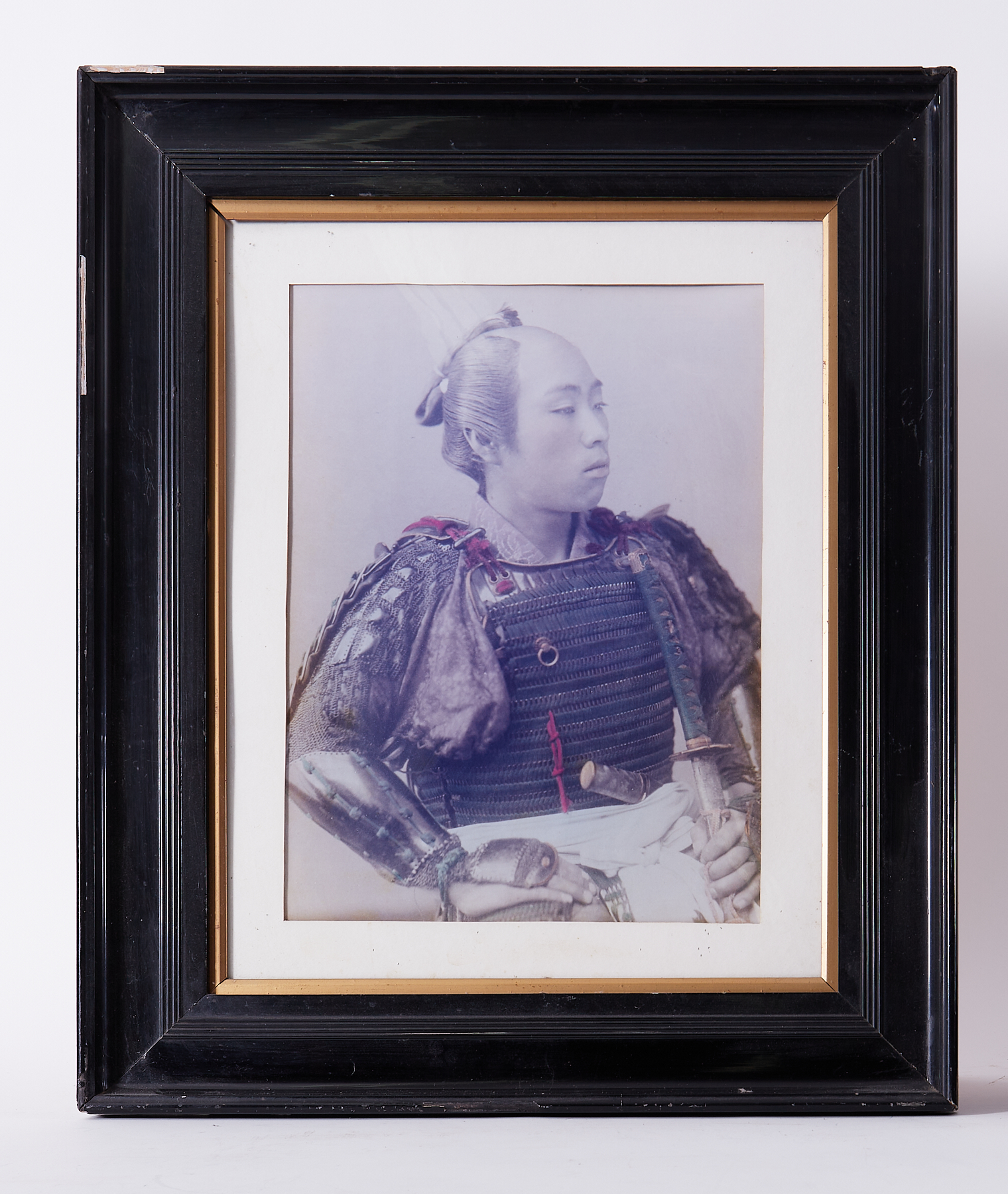 A vintage photograph of a Samurai warrior, hand coloured, 40cm x 30cm, framed and glazed, overall