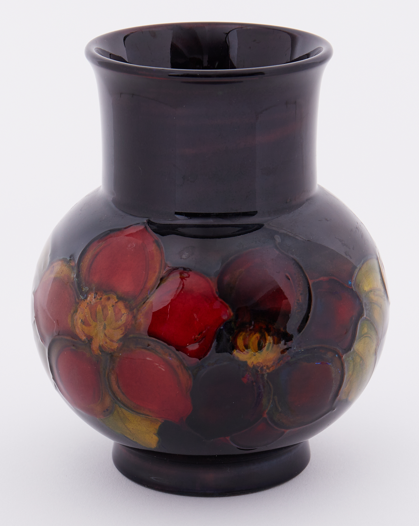 A Moorcroft Flambe Clematis vase, height 13cm.