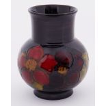 A Moorcroft Flambe Clematis vase, height 13cm.