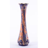 A William Moorcroft Macintyre vase, decorated with orange and blue flowers, circa 1903,