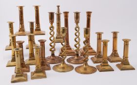 A collection of twenty-one 19th century and later brass candlesticks, mainly in pairs.