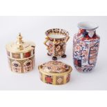Royal Crown Derby a small box and cover, sugar pot with lid, twin handle cup and small Imari vase (
