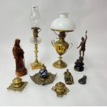 Two oil lamps, carved figure, spelter figure, brass and ceramic ink well etc.