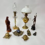 Two oil lamps, carved figure, spelter figure, brass and ceramic ink well etc.