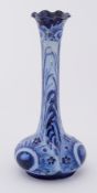 A William Moorcroft Florian Ware 'Peacock' tall stemmed vase circa 1902, height 17cm.