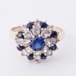 A 9ct yellow gold round cluster style cocktail ring set with round cut blue sapphires, total