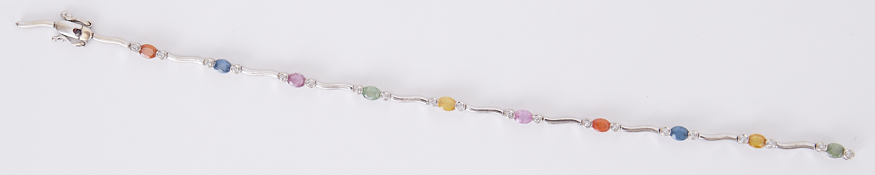 A white gold bracelet set with oval cut multi-coloured sapphires set in between small round - Image 2 of 2