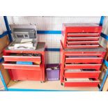 Two tool cabinets on wheels and one top box tool cabinet each containing a collection of various