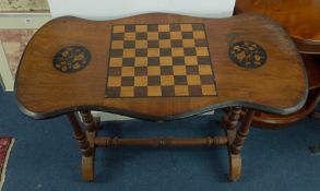 Victorian walnut games table on stretcher base.