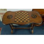 Victorian walnut games table on stretcher base.