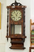 A Victorian wall clock with parquetry inlaid case.