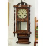 A Victorian wall clock with parquetry inlaid case.