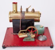Mamod steam engine with boiler, 6" high, 8" square on Meccano platform.