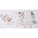 A mixed lot of silver jewellery & costume jewellery to include bangles, lockets, crosses, chains,