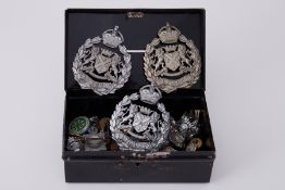 A selection of various military and other cap badges, pendants, including silver Devon Cadet Camp,