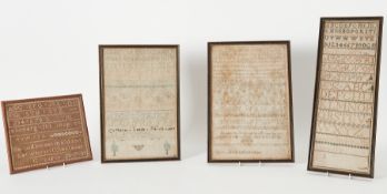 A group of four 19th century needlework samplers including one by Catherine Lambell, 1834 (faded).