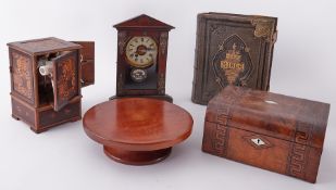 An Antique parquetry inlaid smokers cabinet, four doors containing various clay pipes together