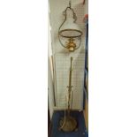 A brass floor standing rising lamp together with a hanging brass oil lamp with white shade (2)