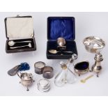 A mixed lot to include two silver napkin rings, 3.06oz, silver fabric lined pot, 1.31oz, silver shoe