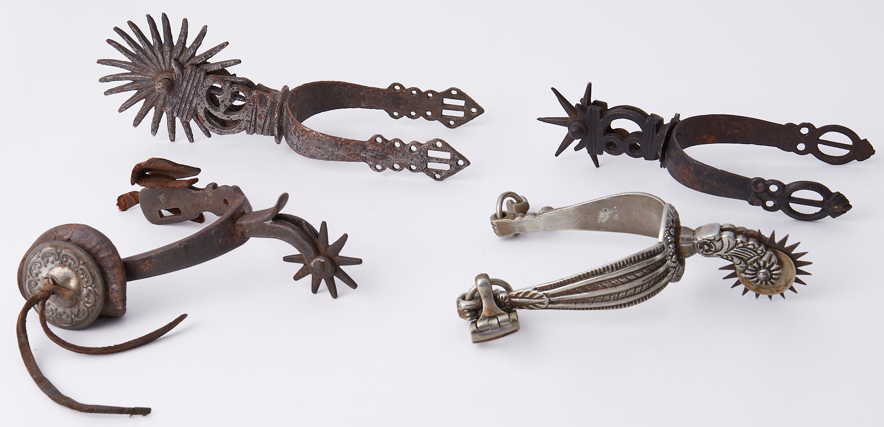 Four various antique rowel spurs (4)