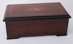 A Victorian single cylinder music box in inlaid cabinet (poor condition combe), width 19 inches.