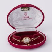 Tudor, a vintage ladies 9ct yellow gold Tudor wristwatch, number 8047, with original inner & outer