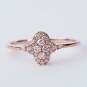 A 9ct rose gold ring set with 0.25 carats of round cut natural pink diamonds, 1.65gm, size R 1/2,