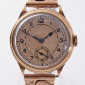 A 9ct gold vintage wristwatch engraved on the back 'Presented to Col W T Woods by the Officials of