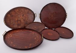 Six various Victorian mahogany and inlaid serving trays.