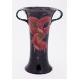 A William Moorcroft early twin handled Pomegranate vase stamped Burslem, height 27cm.