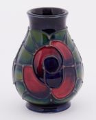 A Moorcroft 'Rose' design miniature vase, height 10cm.