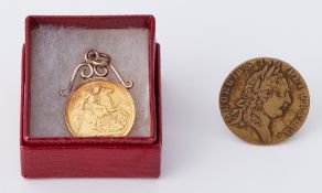 An Edward VII 1905 half sovereign in pendant mount, 4.67gm and a George III Guinea token.