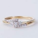 An 18ct yellow gold three row cross-over style ring set with 0.25 carats of round brilliant cut