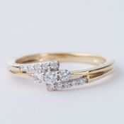 An 18ct yellow gold three row cross-over style ring set with 0.25 carats of round brilliant cut