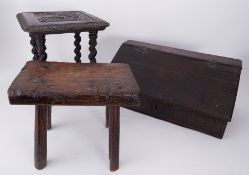 A dark carved oak small stool inscribed with a crest and 'Graham Fyntns' together with a rustic