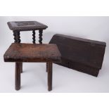 A dark carved oak small stool inscribed with a crest and 'Graham Fyntns' together with a rustic