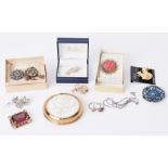 A large quantity of costume jewellery to include paste stone set brooches, gem set, etc, four